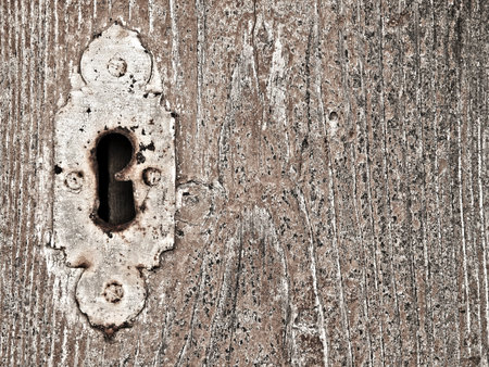 Detail image of an old wooden door and old keyholeの写真素材