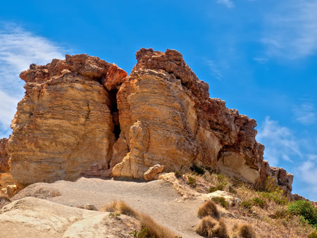 This rocky outcrop is one of the most well known geologic features on the Northern side of the island of Malta. It however is in imminent danger of collapse as it lies on clay sediment, and the fissure running through its centre gets wider every year. の写真素材
