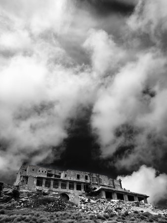 The derelict ruins of what once was a hotel at one of Malta's most popular beaches.の写真素材