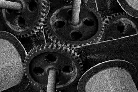 Abstract monochrome image showing rusty cog wheels