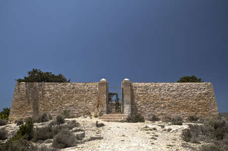 The derelict and disused cemetery on the small island of Comino in Malta.のeditorial素材