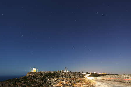 Lonf exposure of the northern skies showing star trails around Polaris or the Norther Star.  210 second exposure over Dingli Radar Station in Maltaの写真素材