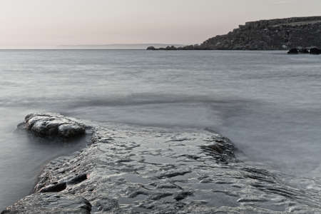 Detail of a rocky reef with a surreal, cold feel.の写真素材