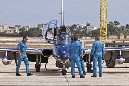 LUQA, MALTA - 25 SEP - Crew members from the Italian Frecce Tricolori aerobatic team check their...