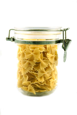 Pasta farfalle in a transparent jarの写真素材