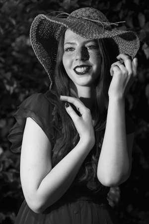 Young and happy woman wearing a hatの写真素材