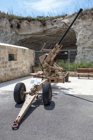 TA' QALI, MALTA - APR 20 - An old Anti Aircraft gun on display at The Malta Aviation Museum on 20 April 2013のeditorial素材