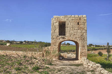 An elevated birthing chamber in the Maltese countryside, with an underlying arched underpass.の写真素材