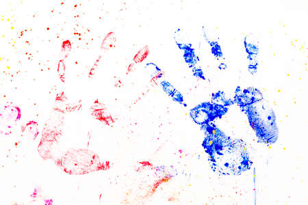 Diversity and friendship portrayed by two colored handprints over white backgroundの写真素材