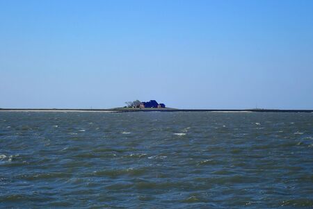 A dwelling mound of the island Hallig Hooge in the German North Seaの写真素材