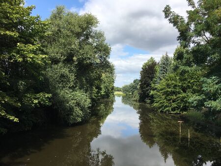 Clouds reflect in the Emssee in Warendorf in the Muensterlandの写真素材