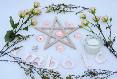 Winter altar for Imbolc sabbath made on the snowの写真素材