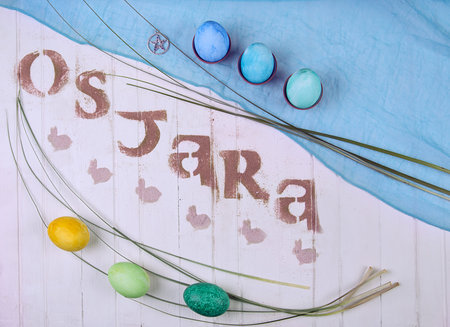 Ostara sabbath symbols made with food typography. Colored eggs and rabbits