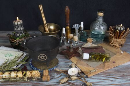 Wiccan altar with magical components, wicker pentacle and cauldronの写真素材