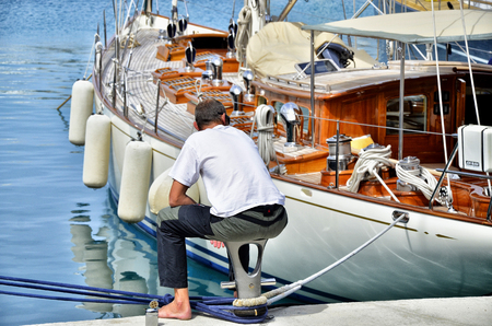 Man seeing boats in a harborのeditorial素材