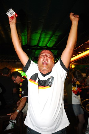 A man celebrating the victory of Their football teamのeditorial素材