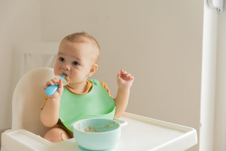 the kid does not want to eat food on the table. high quality photoの写真素材