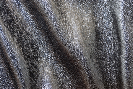 Leather cloth of dark tones for clothes and furniture, for other subjects, a background and textureの写真素材