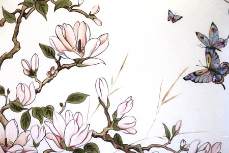 Ancient panel on fabric with the image of branches and flowers of an apple-tree, a butterflyの写真素材