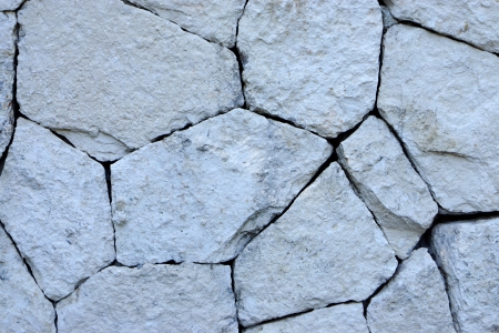 Old flat wall from a big gray stoneの写真素材