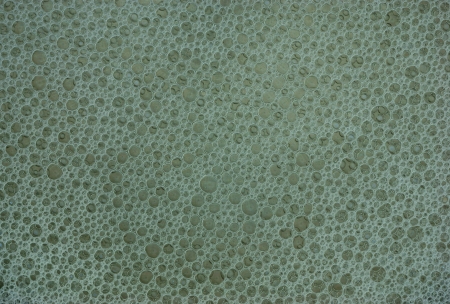 Gray-blue texture with soap bubbles for a background and space fillingの写真素材