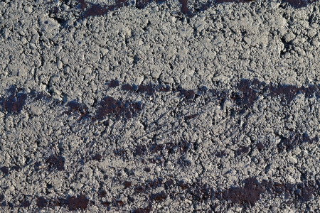 Bituminous spots on a surface of the road for asphalt layingの写真素材