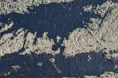 Bituminous spots on a surface of the road for asphalt layingの写真素材