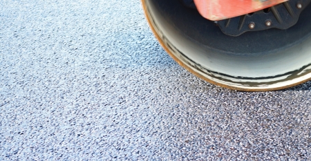 Fragment of expansion and asphalt consolidation by a big skating rink on the highwayの写真素材