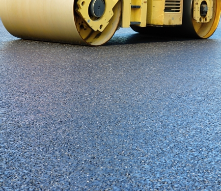 Fragment of expansion and asphalt consolidation by a big skating rink on the highwayの写真素材