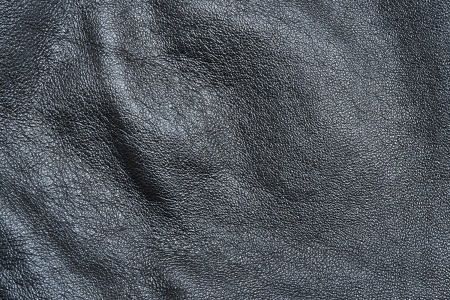 Texture of the black crumpled skin for a background and a surfaceの写真素材