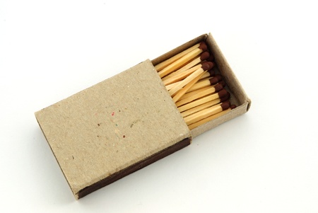 Wooden matches in an open old cardboard boxの写真素材