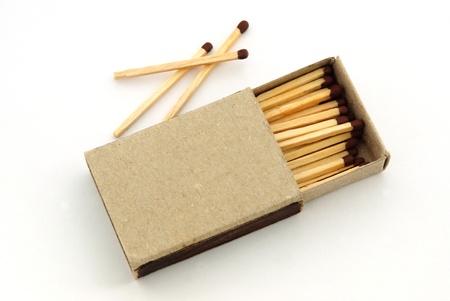 Wooden matches in an open old cardboard boxの写真素材