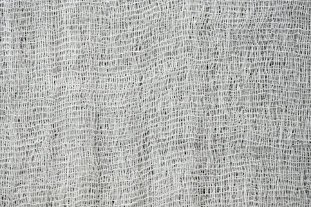 Texture of gray fabric from a gauze for a background and a surfaceの写真素材