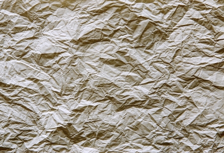 The crumpled sheet of paper of brown color for a background and an abstract surface, for the textの写真素材