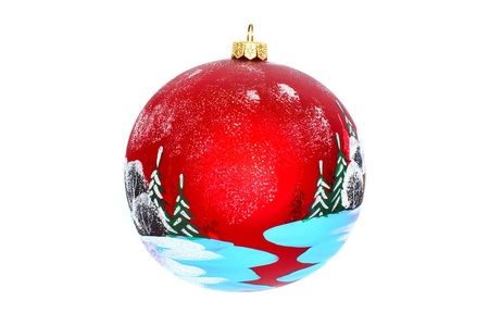 Christmas jewelry and toys - a ball for a New Year tree, a glade in the winter wood, a place for the text, isolated on a white backgroundの写真素材