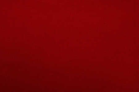 Crimson texture of fabric from a textile material for an abstract background, for an empty surface and for wall-paperの写真素材