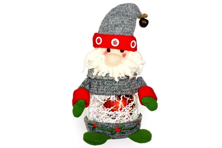 The Christmas toy of Santa Claus for the festive fir-tree, isolated on a white background, attentively and cheerfully looksの写真素材