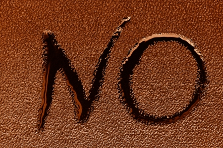 The word "NO" on black skin is written by a liquid closeupの写真素材