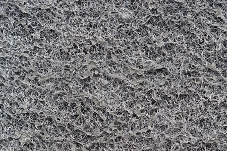 Texture of the black synthetic coal filter for abstract backgroundsの写真素材