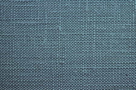 Texture of rough dense fabric for an azure background and abstract wallpaper, a closeupの写真素材