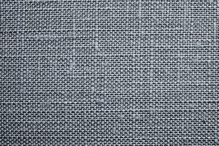 Texture of rough dense fabric for a silvery background and abstract wallpaper, a closeupの写真素材