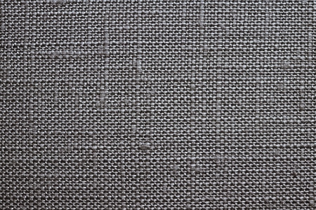 Texture of rough dense fabric for a black background and abstract wallpaper, a closeupの写真素材