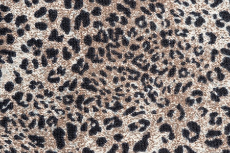 texture of knitted fabric with a leopard pattern for abstract backgrounds and for wallpaperの写真素材