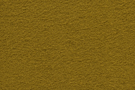 texture of rough fleecy fabric of mustard color for backgrounds and for wallpaperの写真素材