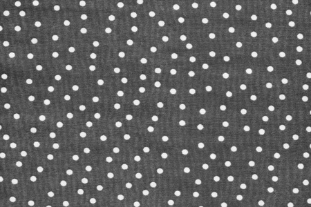 white peas on a gray background of textural knitted fabricの写真素材