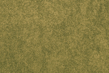 abstract texture terry cotton fabric closeup for a yellow-green backgroundの写真素材