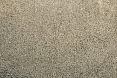 abstract background from texture of old shabby beige paper fabricの写真素材