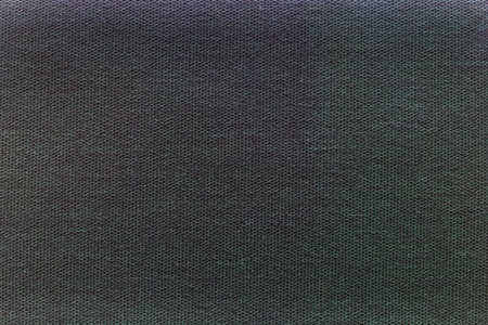 the abstract background is executed from spotty texture on a black green surfaceの写真素材