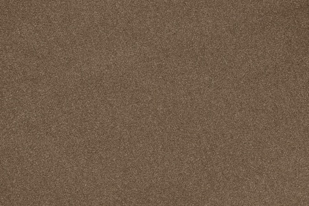 texture of cicatricial synthetic fabric of an abstract background of brown colorの写真素材
