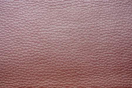 glossy texture of skin and imitation leather of pink color for an abstract background and for...